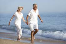 bigstock-Senior-Couple-Enjoying-Beach-H-91148144