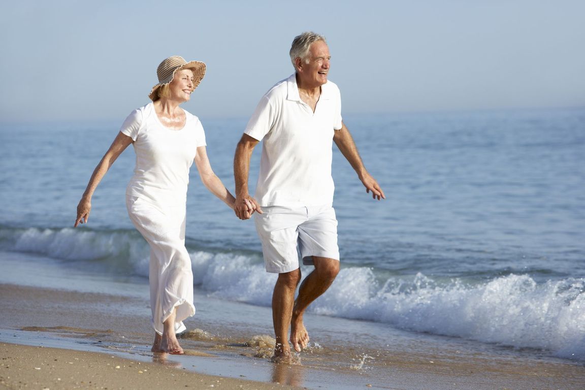 bigstock-Senior-Couple-Enjoying-Beach-H-91148144