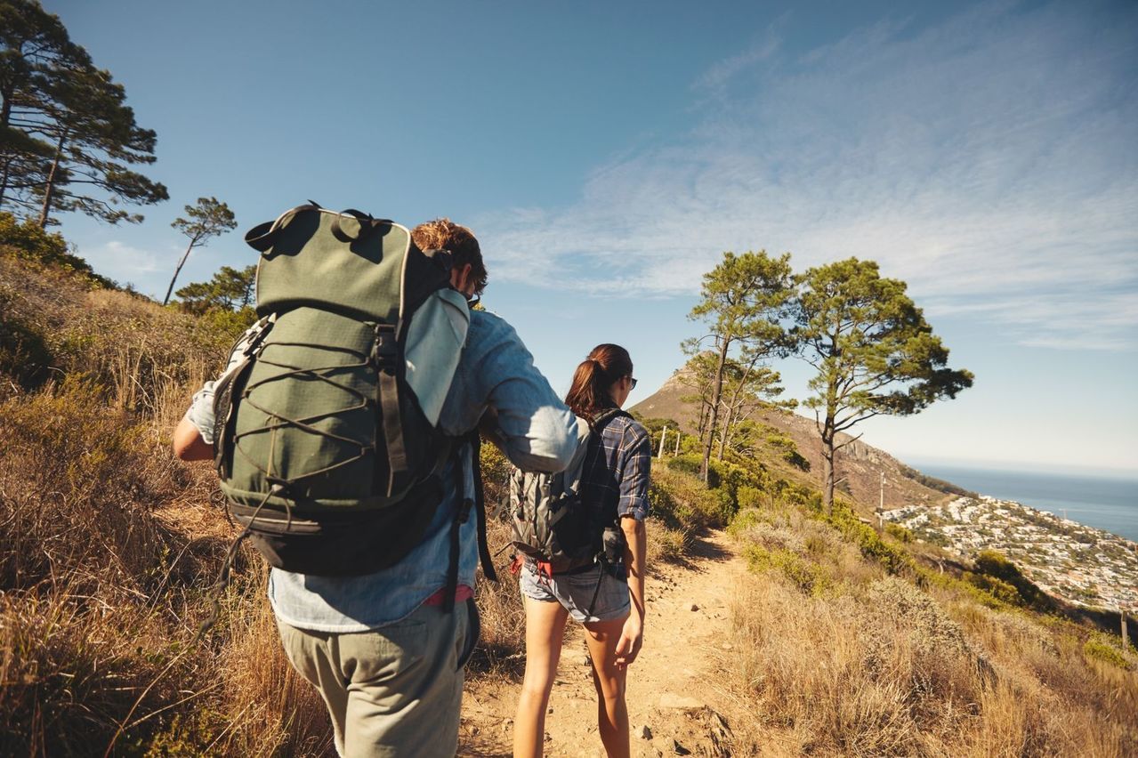 bigstock-Young-Couple-Hiking-In-Mountai-93521687_kraken